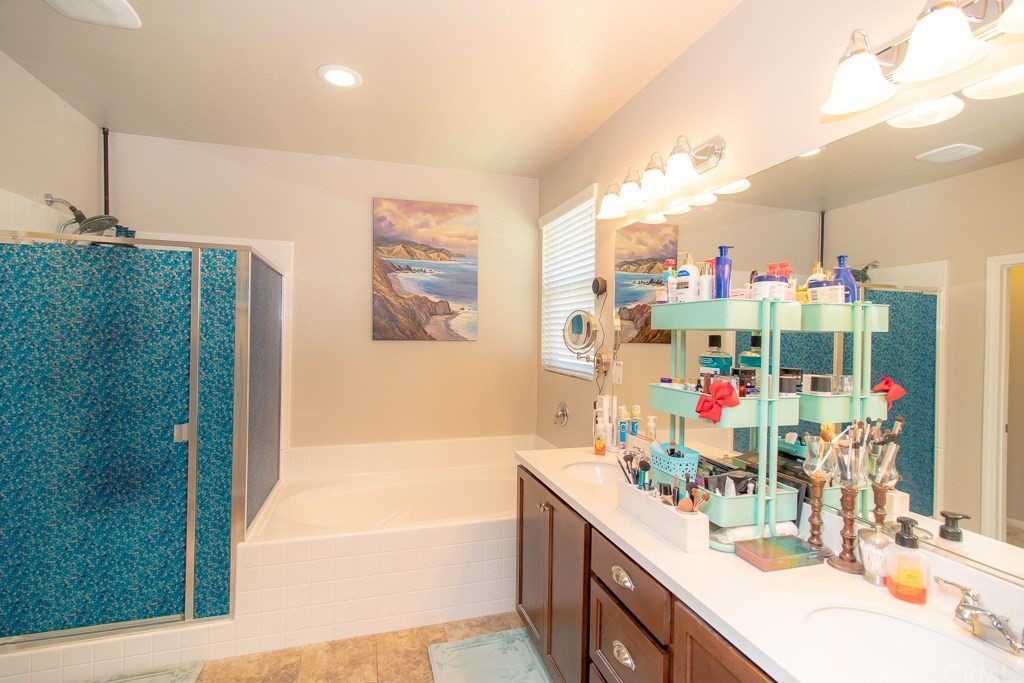 35251 Smith Avenue Beaumont, CA 92223 - Photo 17 of 33 a bathroom with a tub sink and mirror