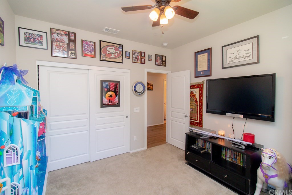 35251 Smith Avenue Beaumont, CA 92223 - Photo 21 of 33 a view of a livingroom with workspace and a flat screen tv
