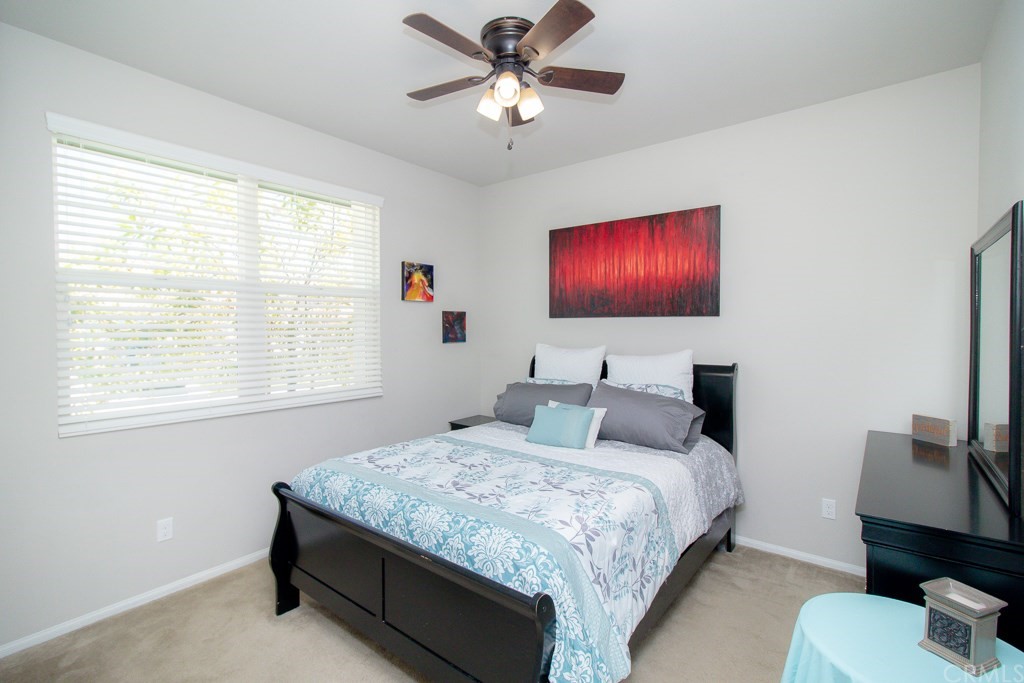 35251 Smith Avenue Beaumont, CA 92223 - Photo 24 of 33 a bedroom with a bed and a flat screen tv