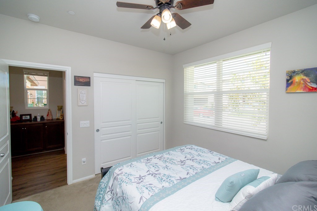 35251 Smith Avenue Beaumont, CA 92223 - Photo 25 of 33 a bedroom with a bed and wooden floor