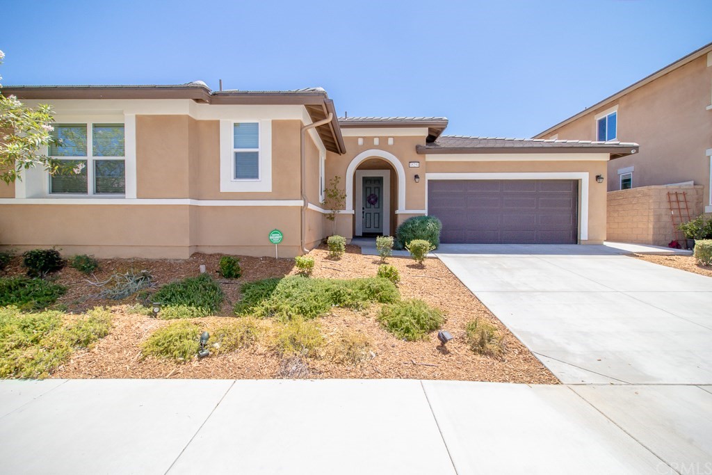 35251 Smith Avenue Beaumont, CA 92223 - Photo 3 of 33 a front view of a house with garden
