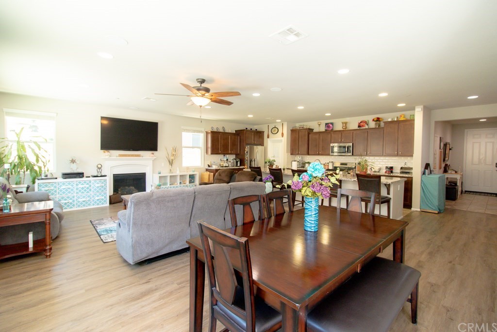 35251 Smith Avenue Beaumont, CA 92223 - Photo 7 of 33 a living room with fireplace furniture and a flat screen tv