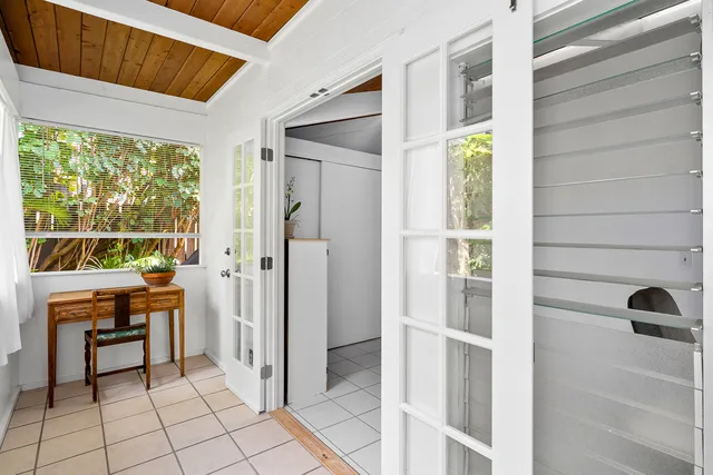 a view of a balcony a chair and table in a patio