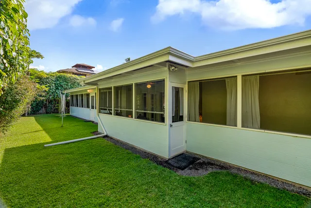 a view of house with backyard