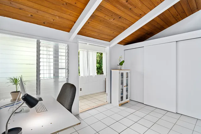 a view of workspace with furniture and window
