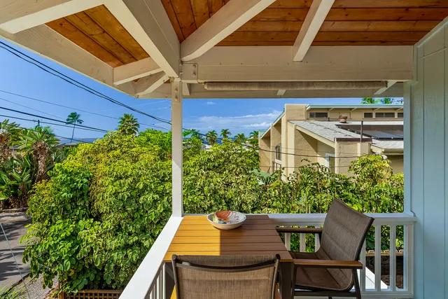 a view of a chairs and table in the patio