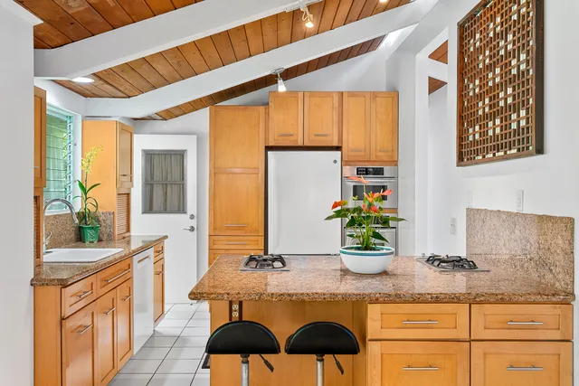 a kitchen with a sink and a large window