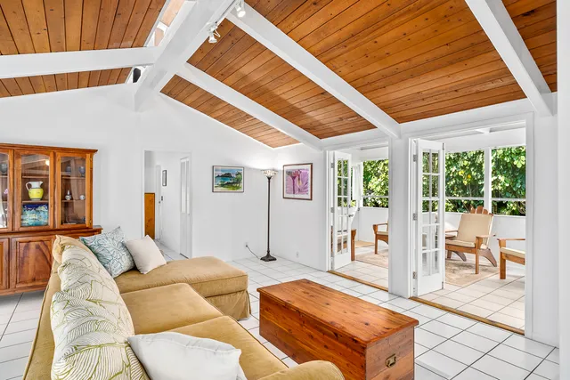 a living room with furniture and large window