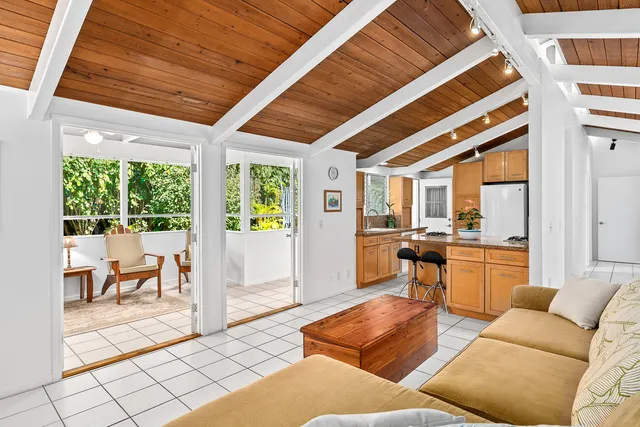a living room with furniture and a table
