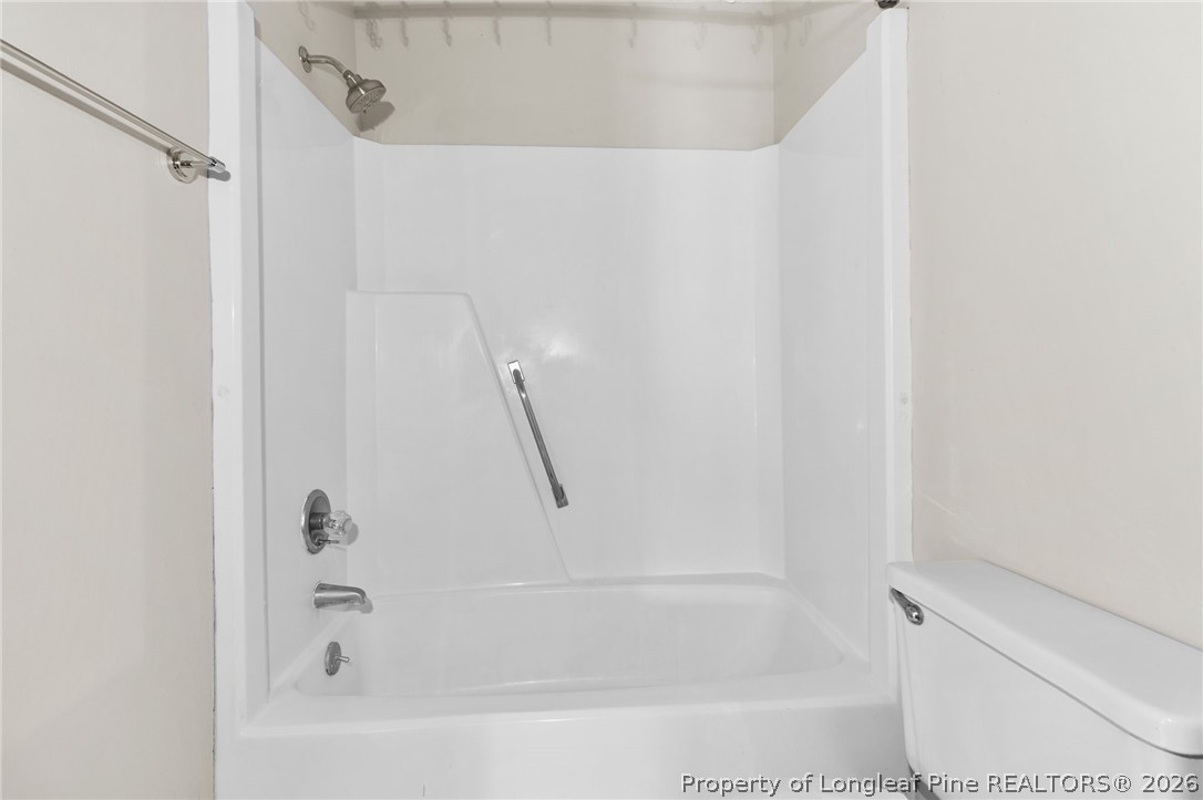 6009 Dalton Road Fayetteville, NC 28314 - Photo 24 of 36 a close view of a bathtub in bathroom