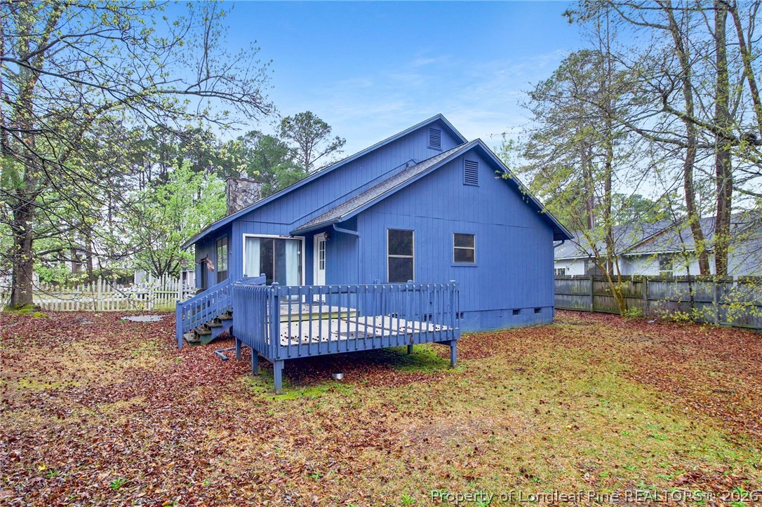 6009 Dalton Road Fayetteville, NC 28314 - Photo 32 of 36 a view of a house with a yard