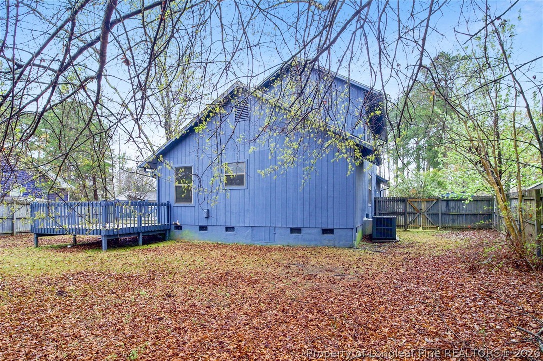 6009 Dalton Road Fayetteville, NC 28314 - Photo 34 of 36 front view of a house with a yard and wooden fence