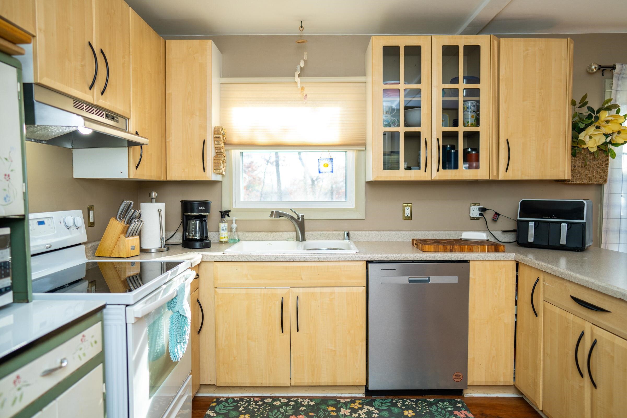 237 Rochester Road Northeast Poplar Grove, IL 61065 - Photo 12 of 28 a kitchen with a sink and cabinets