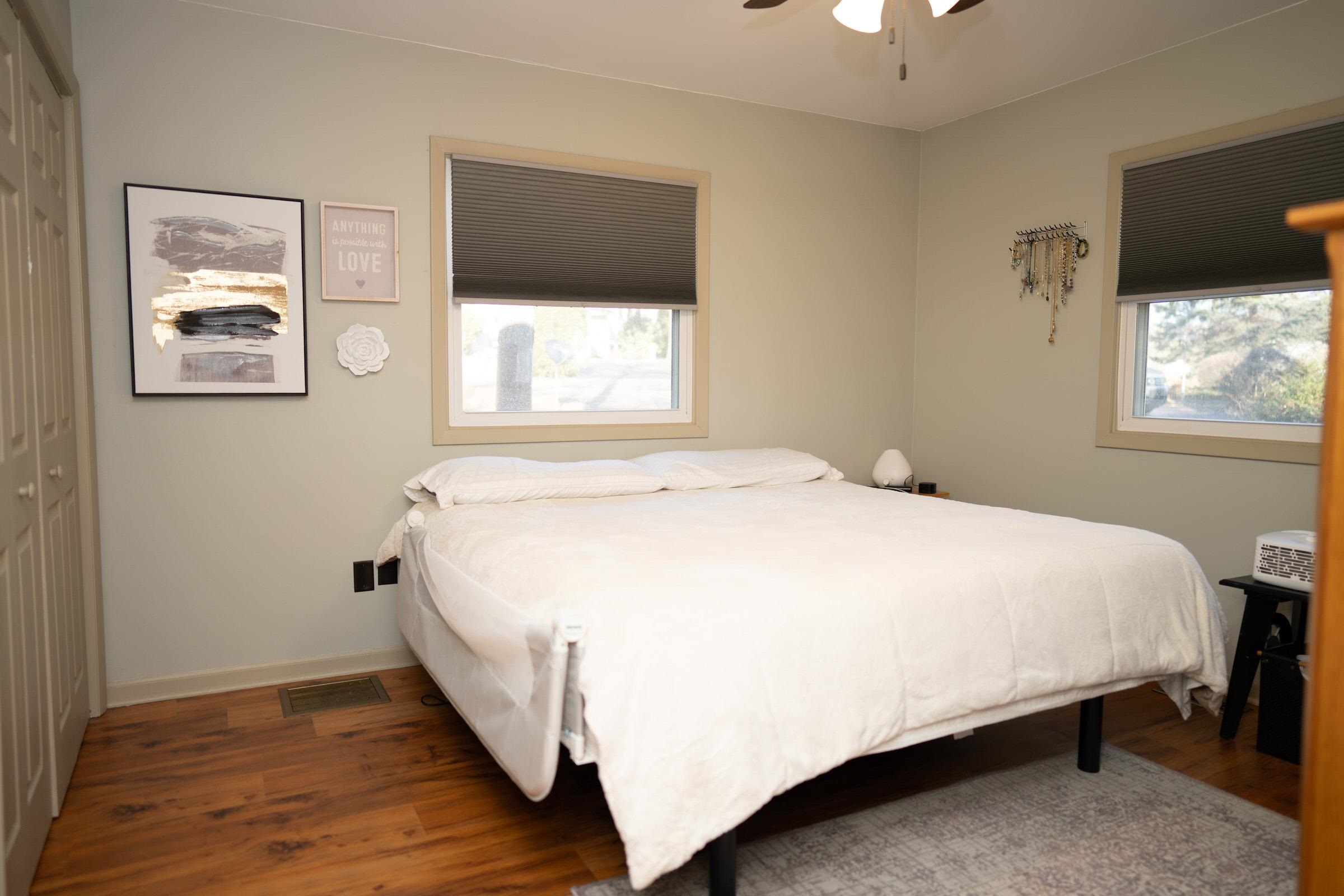 237 Rochester Road Northeast Poplar Grove, IL 61065 - Photo 16 of 28 a large bed sitting in a bedroom next to a window
