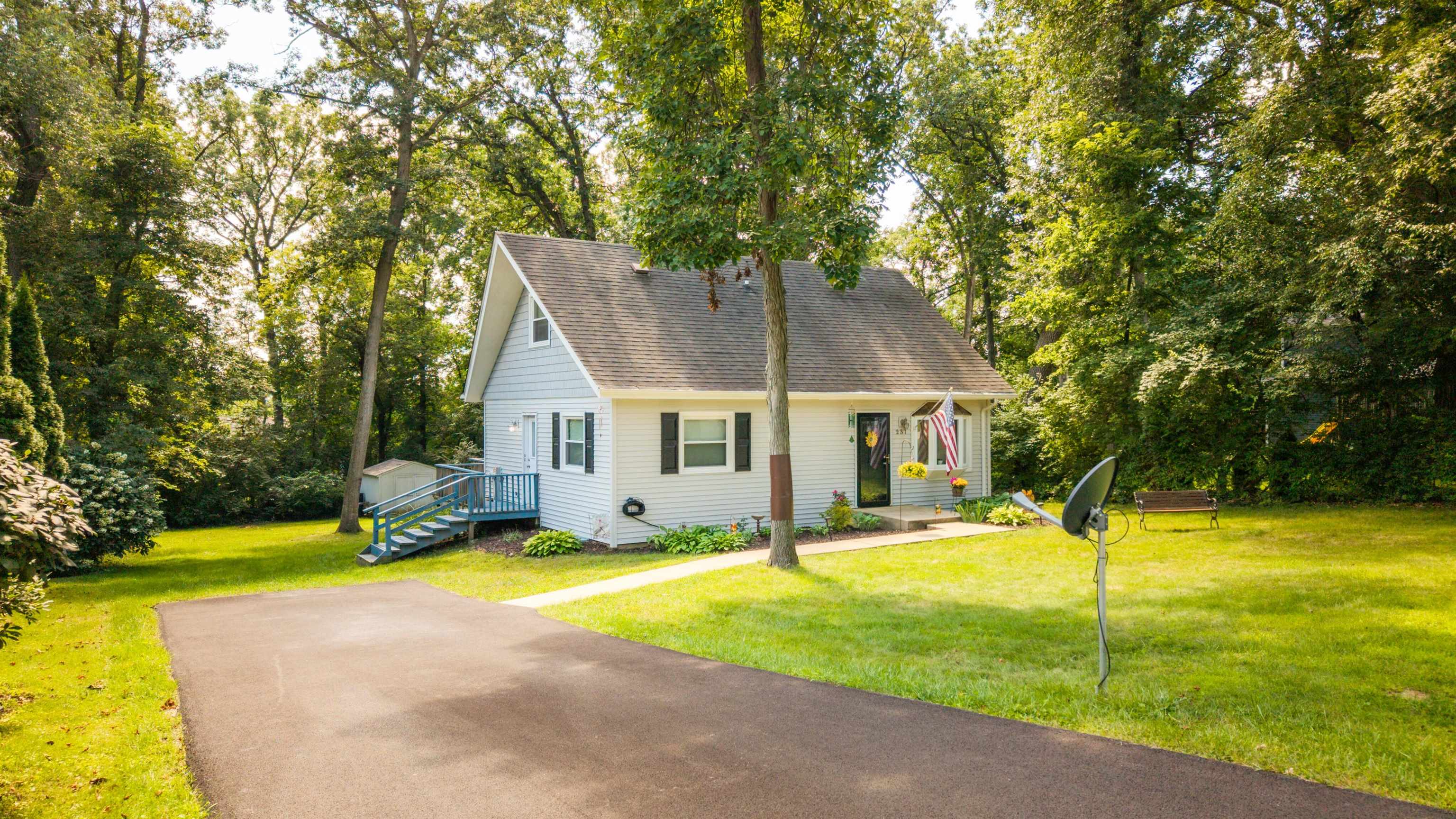 237 Rochester Road Northeast Poplar Grove, IL 61065 - Photo 2 of 28 a view of a house with swimming pool and yard