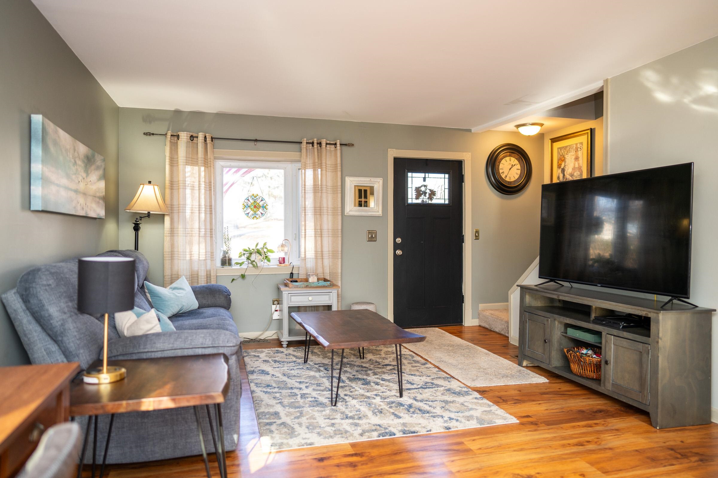 237 Rochester Road Northeast Poplar Grove, IL 61065 - Photo 8 of 28 a living room with furniture and a flat screen tv