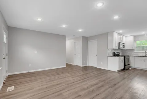 a view of kitchen with wooden floor
