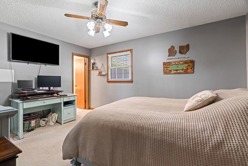 2300 Raspberry Lane Lebanon, TN 37087 - Photo 22 of 48 a bedroom with a bed and a flat screen tv