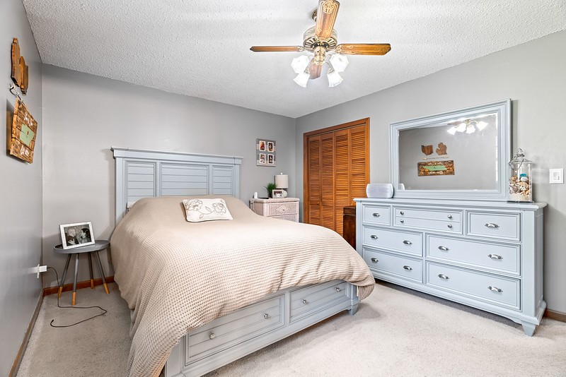 2300 Raspberry Lane Lebanon, TN 37087 - Photo 23 of 48 a bedroom with a large bed and a chandelier