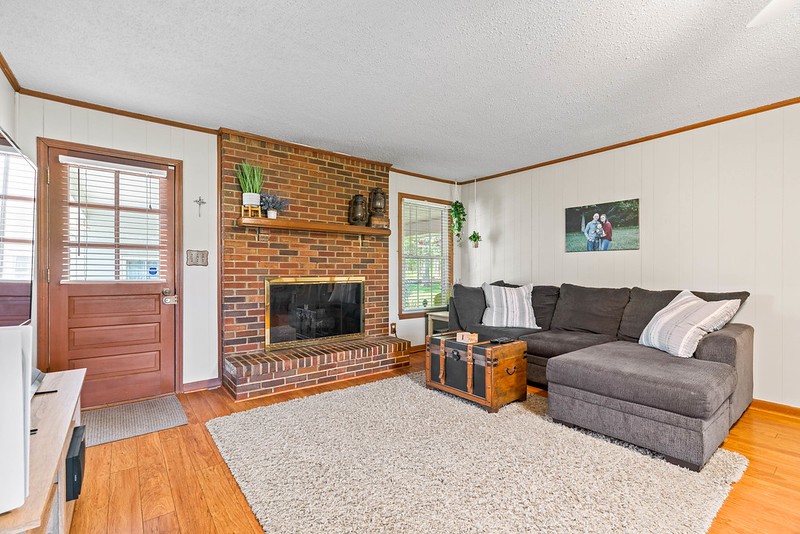 2300 Raspberry Lane Lebanon, TN 37087 - Photo 9 of 48 a living room with furniture and a fireplace