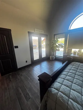 a living room with couch and a large window