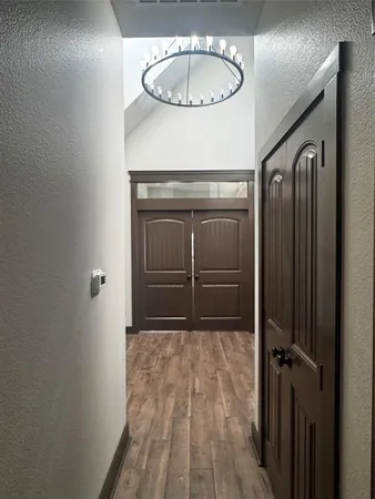 a view of a livingroom with wooden floor