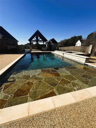a view of swimming pool with an ocean view