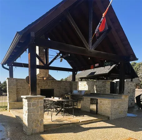 a view of a patio with a table and chairs