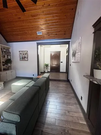 a lobby with furniture and wooden floor