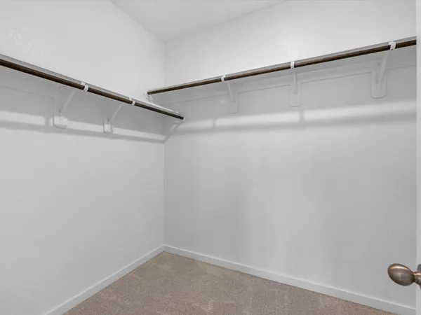 a view of an empty walk in closet