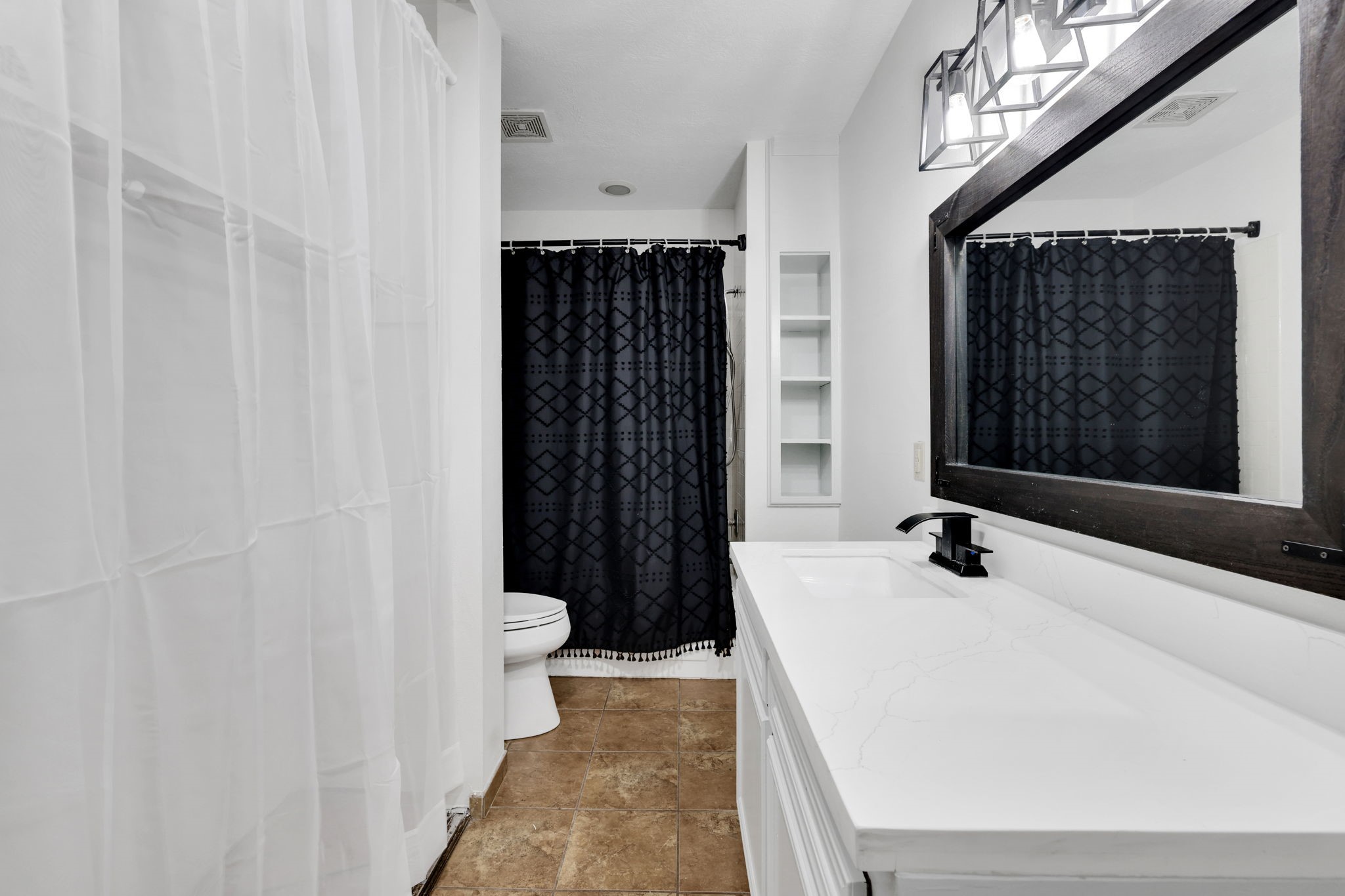 109 Jessica Street Liberty, TX 77575 - Photo 11 of 21 a bathroom with a bathtub and a shower