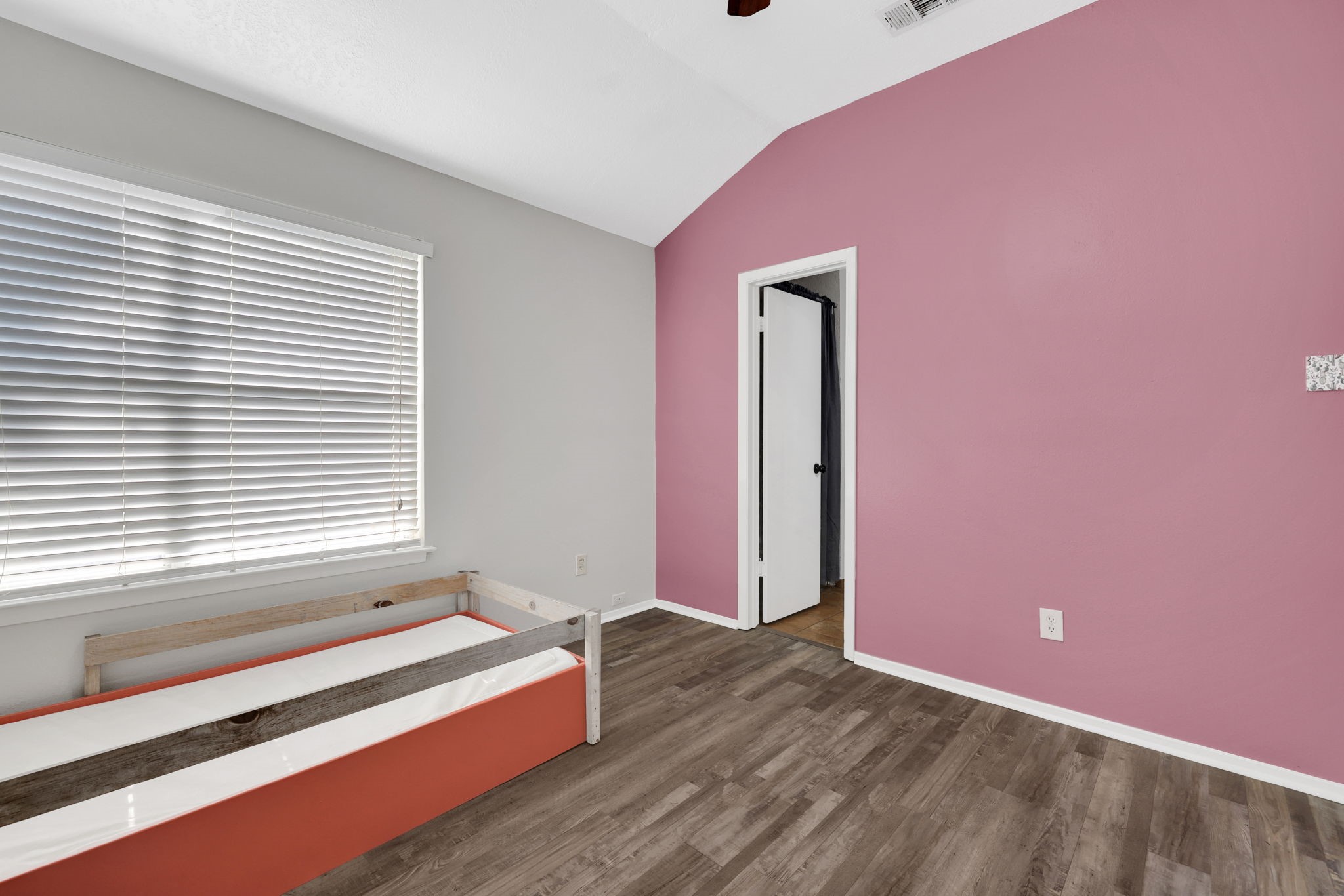 109 Jessica Street Liberty, TX 77575 - Photo 12 of 21 a spacious bedroom with a bed and a window