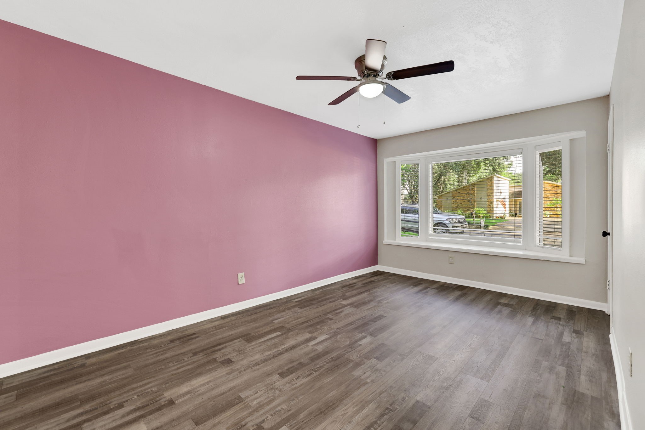 109 Jessica Street Liberty, TX 77575 - Photo 15 of 21 a view of empty room with wooden floor and fan