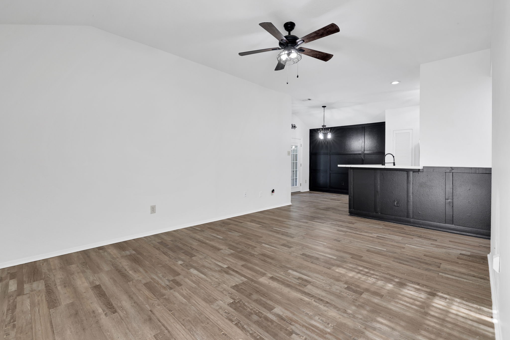 109 Jessica Street Liberty, TX 77575 - Photo 3 of 21 a view of a kitchen with a sink and a refrigerator