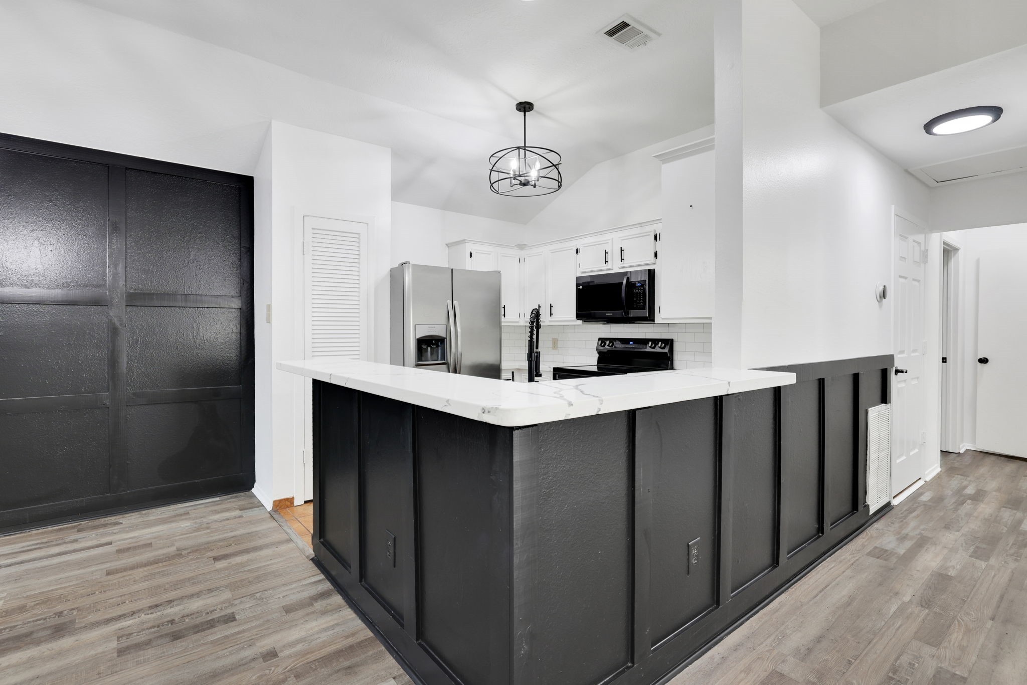 109 Jessica Street Liberty, TX 77575 - Photo 5 of 21 a kitchen with stainless steel appliances a refrigerator and a microwave