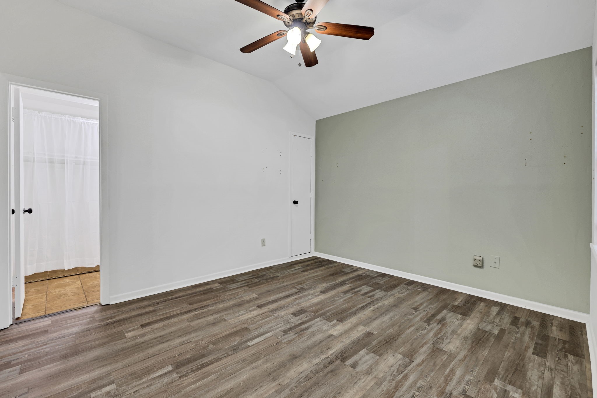 109 Jessica Street Liberty, TX 77575 - Photo 9 of 21 a view of an empty room with wooden floor