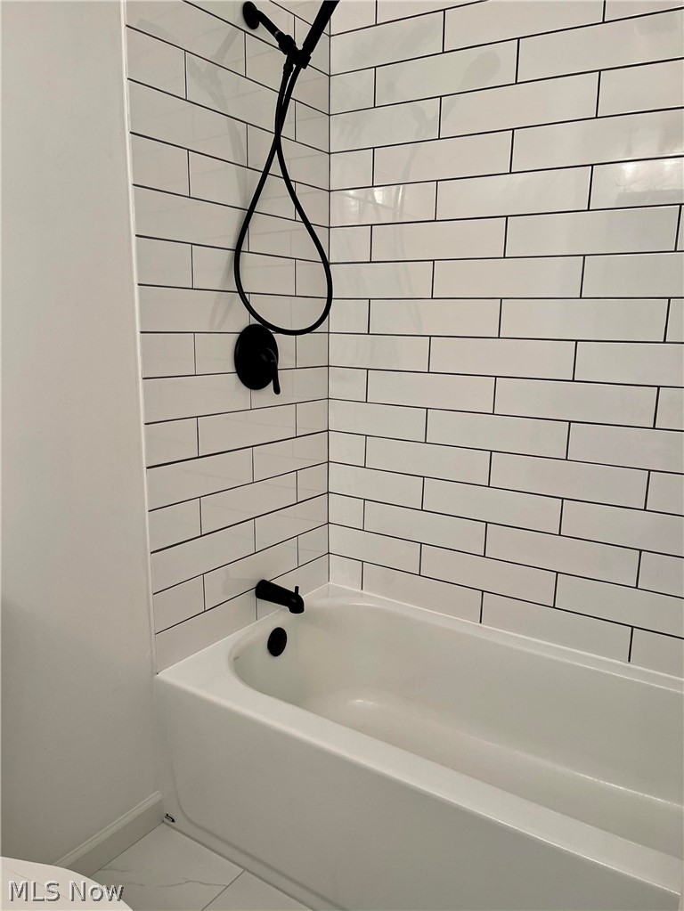 12945 Chamberlain Road Aurora, OH 44202 - Photo 15 of 30 New Tile Surround, Tub, Plumbing Fixtures, Tile Floor in this Shared Full Bath