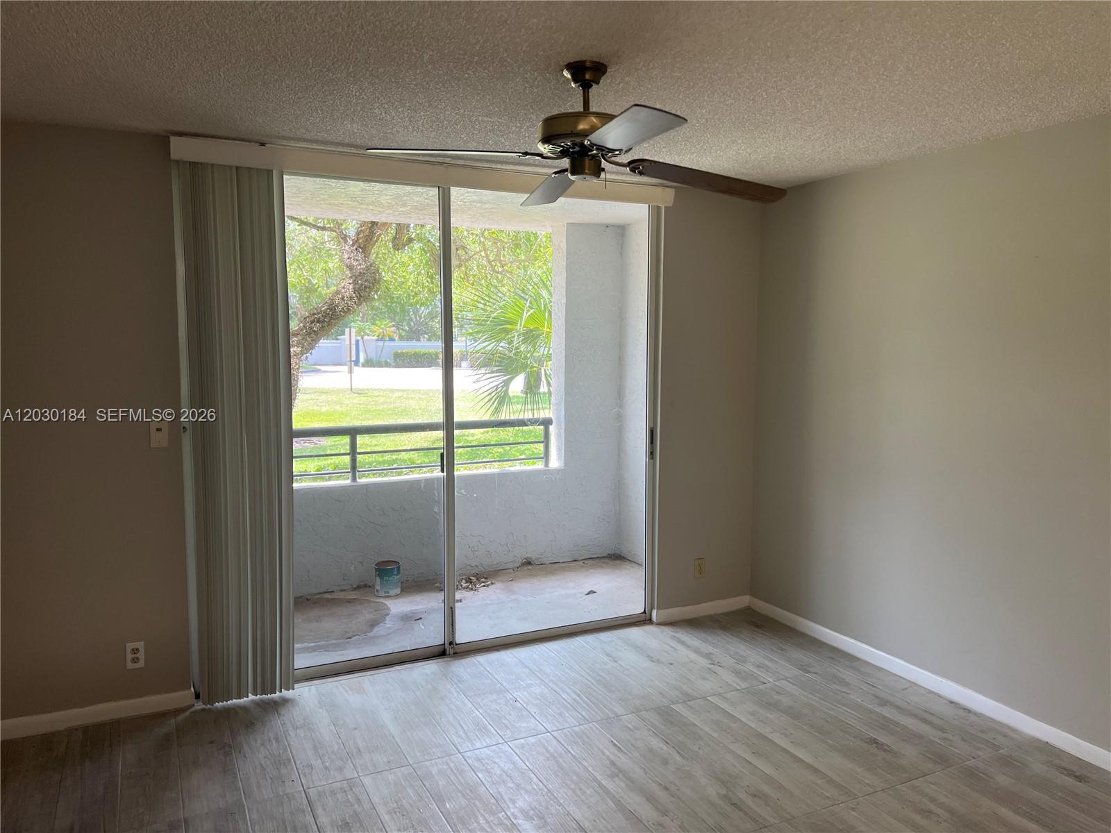 951 Lyons Road, Unit 6104 Coconut Creek, FL 33063 - Photo 2 of 18 a view of an empty room with a window