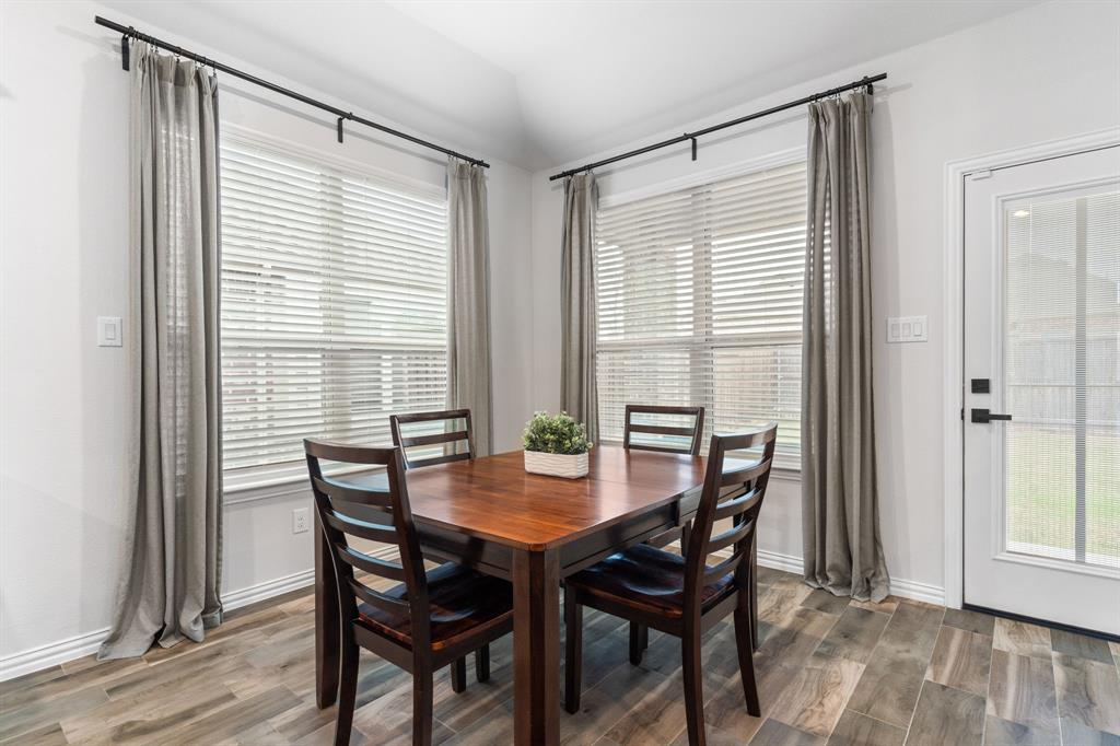 4324 Coffee Mill Road Celina, TX 75078 - Photo 13 of 38 a view of a dining room with furniture and wooden floor