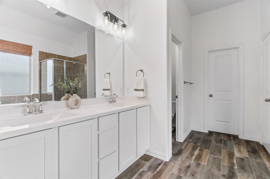 4324 Coffee Mill Road Celina, TX 75078 - Photo 20 of 38 a bathroom with a sink and a mirror