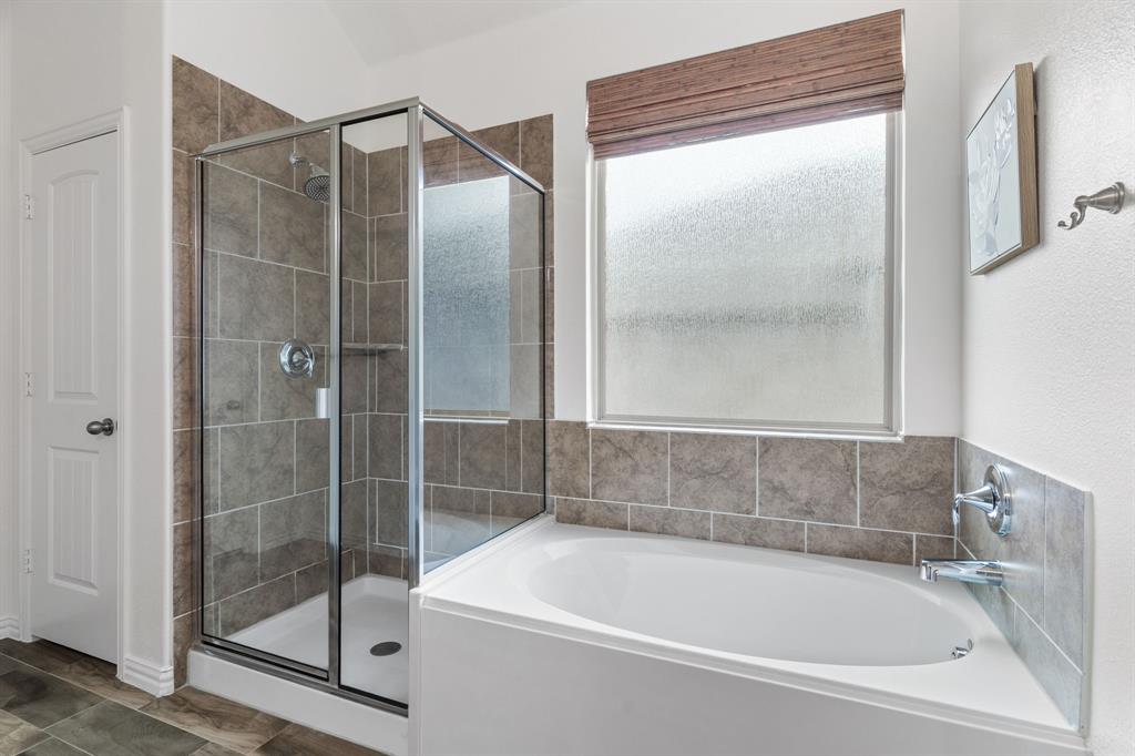 4324 Coffee Mill Road Celina, TX 75078 - Photo 21 of 38 a white bath tub sitting next to a shower