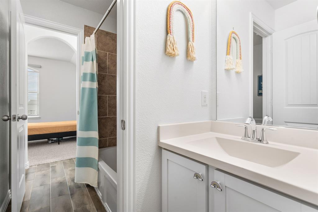 4324 Coffee Mill Road Celina, TX 75078 - Photo 27 of 38 a en suite bathroom with a sink and a mirror