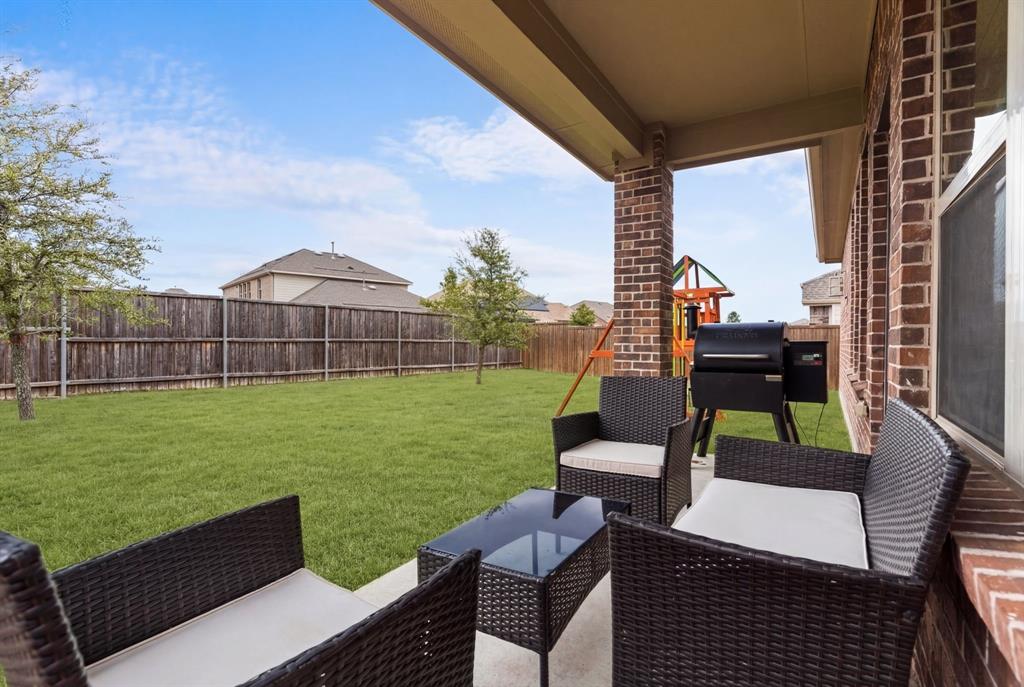 4324 Coffee Mill Road Celina, TX 75078 - Photo 31 of 38 a view of a chairs and table in the patio