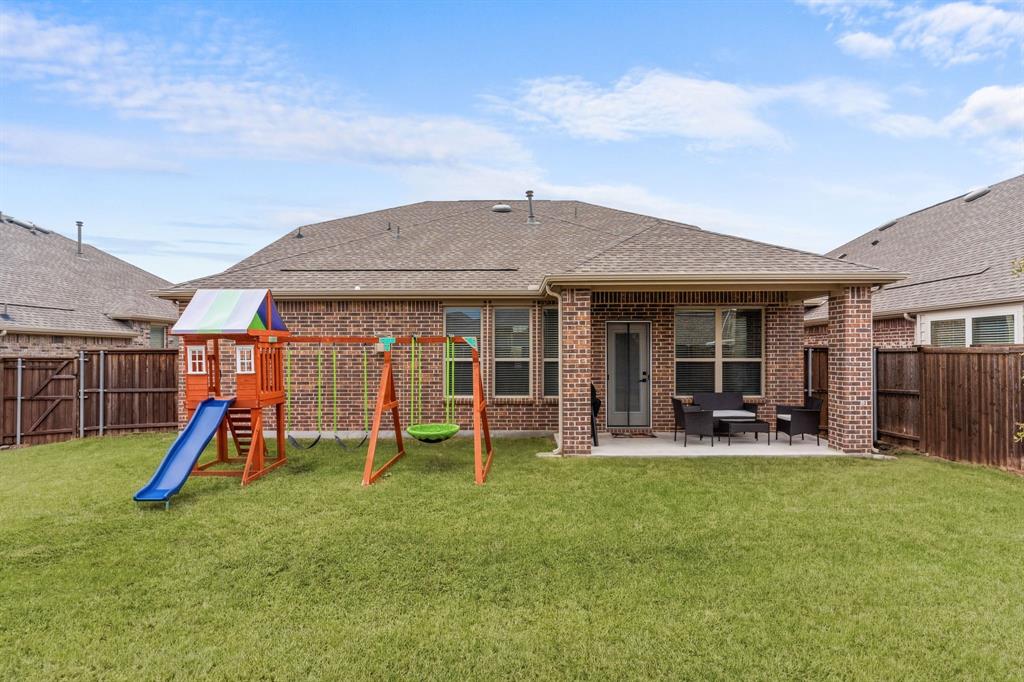 4324 Coffee Mill Road Celina, TX 75078 - Photo 33 of 38 a patio with a table and chairs