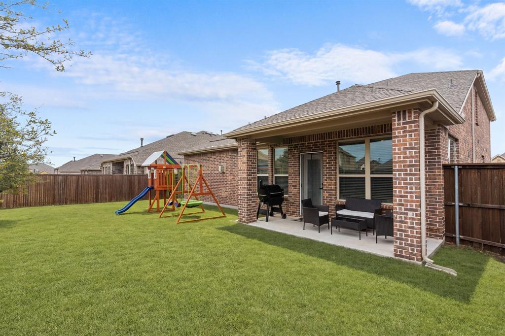 4324 Coffee Mill Road Celina, TX 75078 - Photo 5 of 38 a view of a house with backyard sitting area and garden