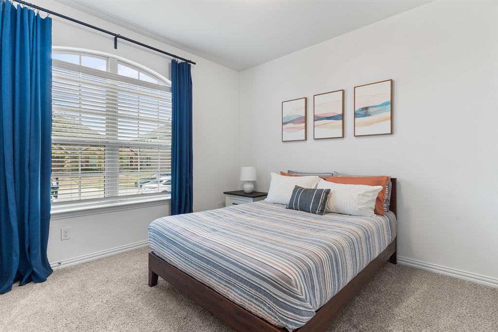 4324 Coffee Mill Road Celina, TX 75078 - Photo 8 of 38 a bedroom with a bed and a window