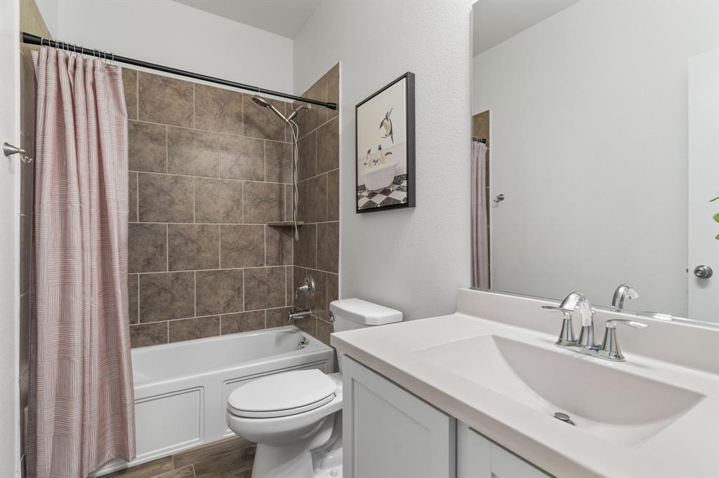 4324 Coffee Mill Road Celina, TX 75078 - Photo 9 of 38 a bathroom with a sink toilet and shower