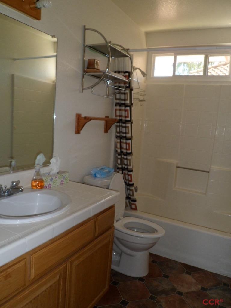 1434 Roper Way Santa Maria, CA 93455 - Photo 13 of 18 a bathroom with a sink a toilet and shower