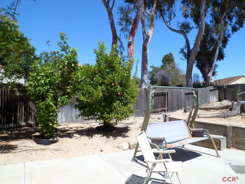 1434 Roper Way Santa Maria, CA 93455 - Photo 17 of 18 a view of a patio with table and chairs and potted plants
