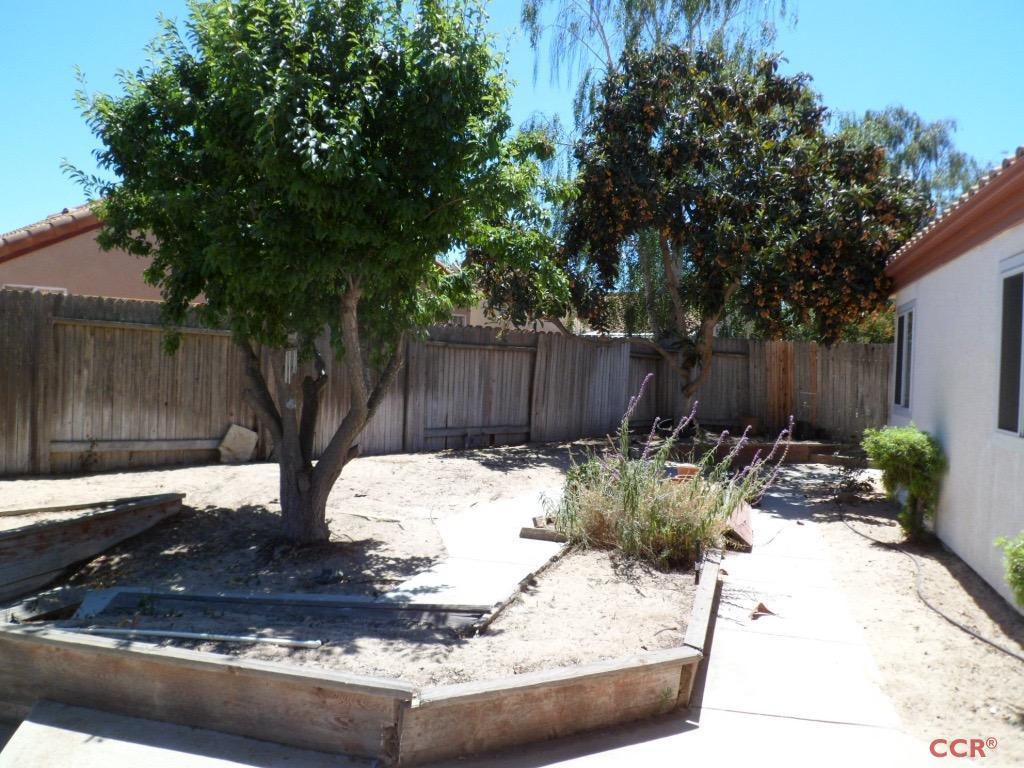 1434 Roper Way Santa Maria, CA 93455 - Photo 18 of 18 a view of a backyard with a tree